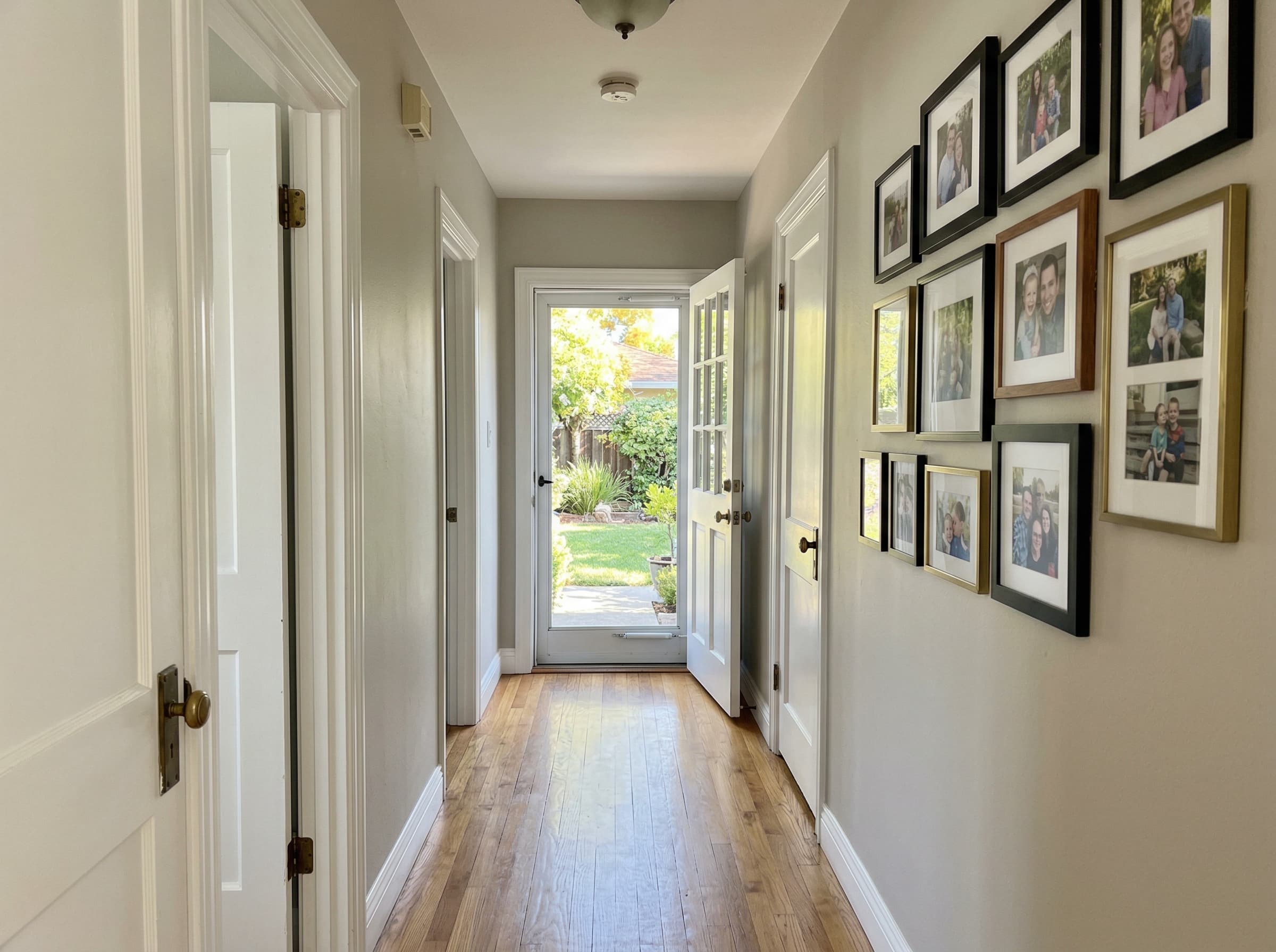 Freshly painted hallway — warm gray walls with white trim, Sacramento residential